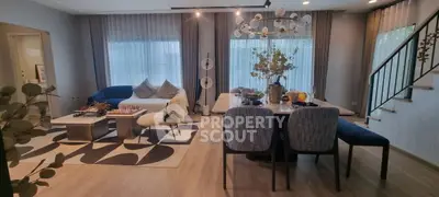 Spacious modern living room with elegant dining area and stylish decor