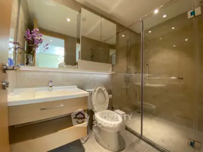 Modern bathroom with glass shower and elegant fixtures