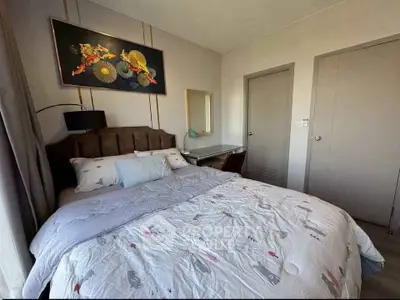 Cozy bedroom with stylish decor and comfortable bedding in modern apartment.