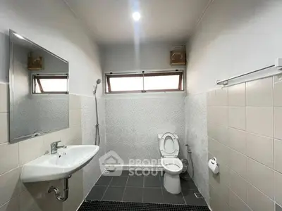 Modern bathroom with sleek fixtures and minimalist design.