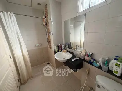 Spacious bathroom with modern fixtures and ample natural light