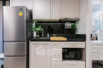 Modern kitchen with sleek appliances and stylish cabinetry