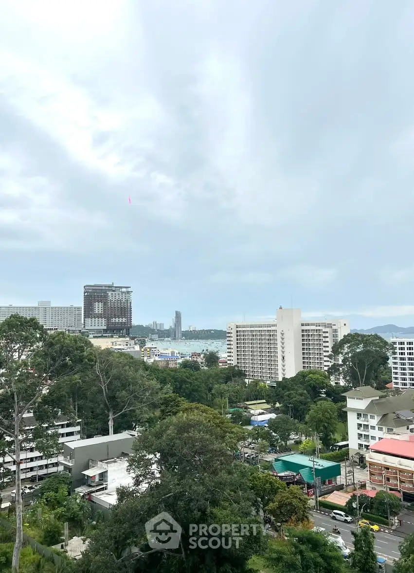 Stunning cityscape view with lush greenery and skyline in the background, ideal for urban living.