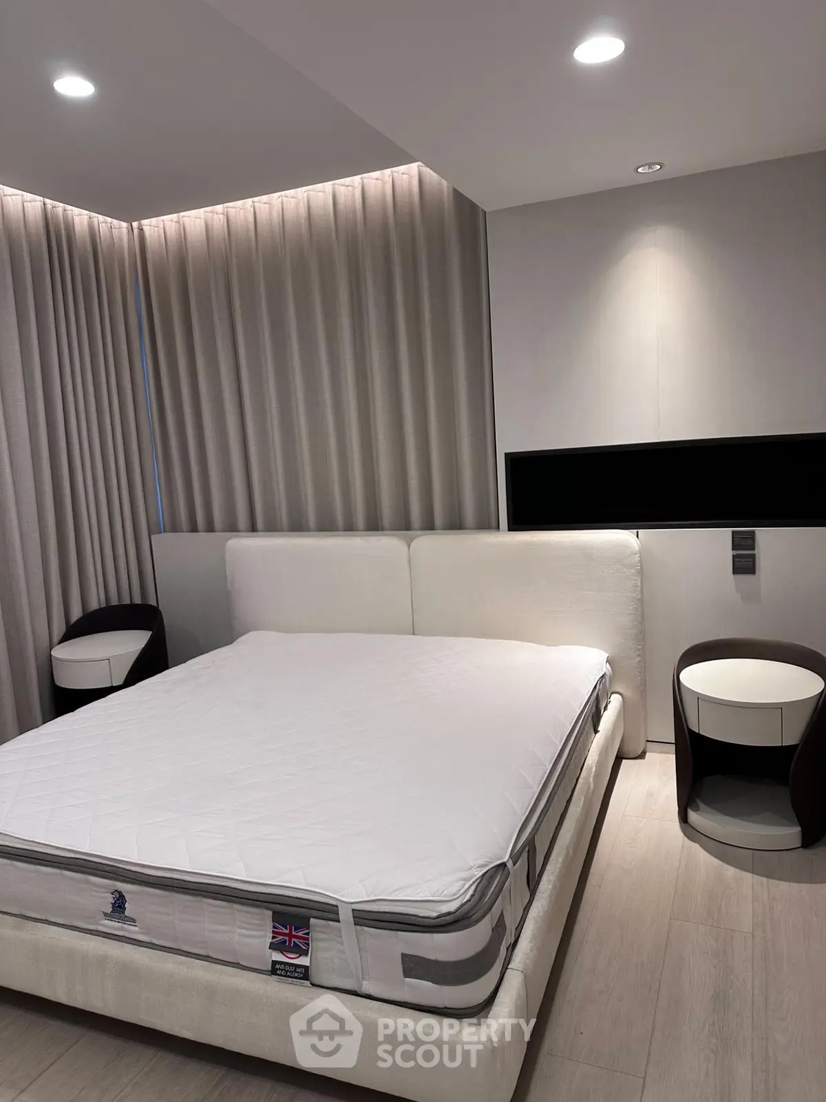Luxurious modern bedroom with elegant lighting and stylish furniture