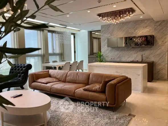 Luxurious open-plan living room with modern kitchen and elegant decor