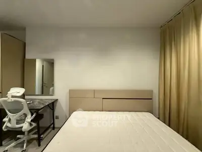 Modern bedroom with minimalist design, featuring a comfortable bed, study desk, and ample storage space.