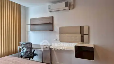 Modern bedroom with study desk and air conditioning in a stylish apartment