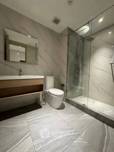 Modern bathroom with sleek design and glass shower enclosure