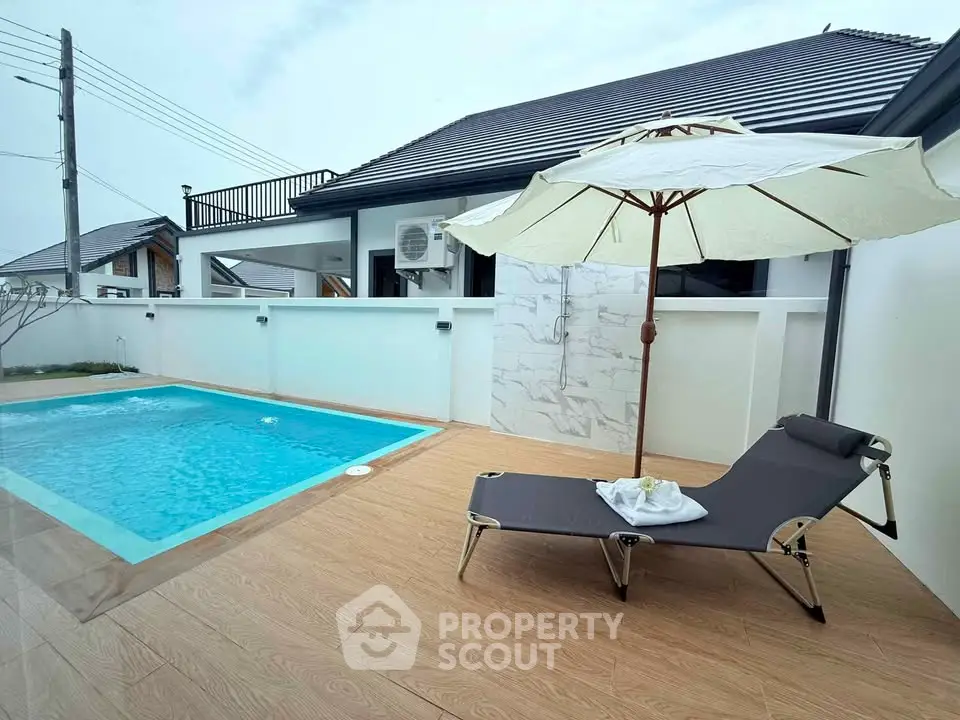 Charming modern villa with private pool and sun lounger, perfect for relaxation and luxury living.