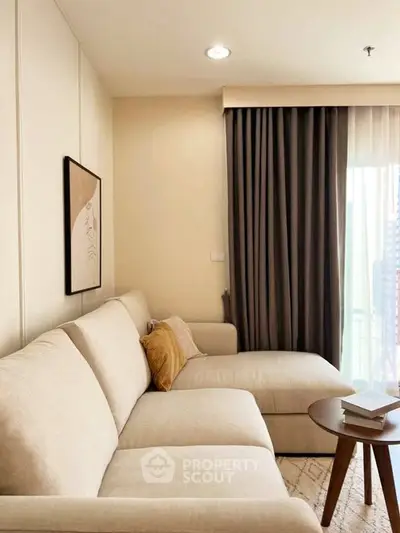 Cozy living room with beige sectional sofa and modern decor