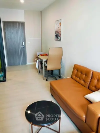 Modern living room with stylish furniture and workspace area