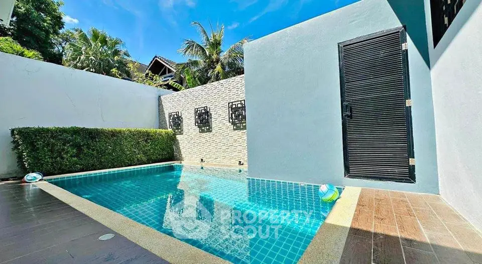 Luxurious private pool with modern design and lush greenery