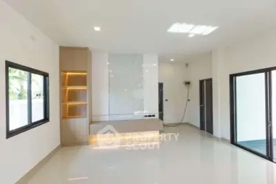 Modern living room with sleek design and built-in shelving