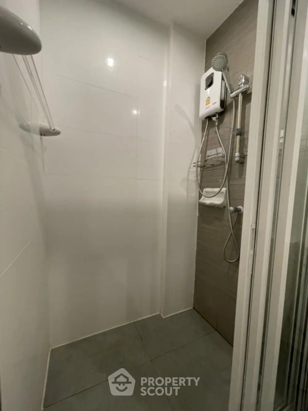 Modern bathroom with sleek shower design and neutral tiles