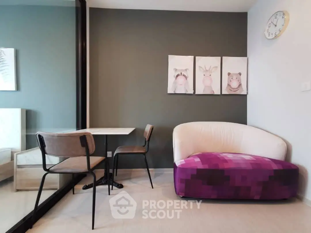 Modern living room with stylish furniture and animal artwork, perfect for cozy relaxation.