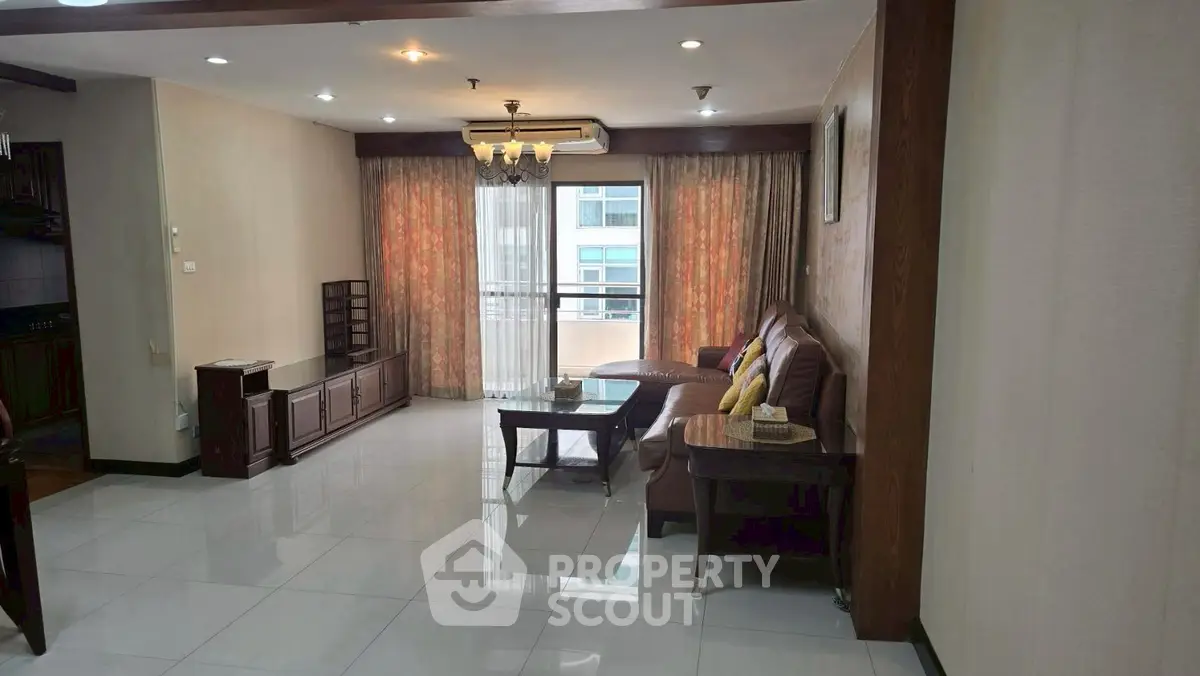 Spacious living room with elegant decor and large windows for natural light.
