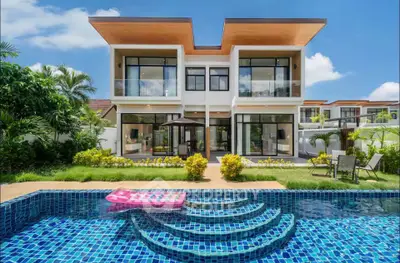 Luxurious modern villa with private pool and lush garden, perfect for serene living.