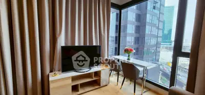 Modern living room with city view, featuring a TV and dining area by large windows.