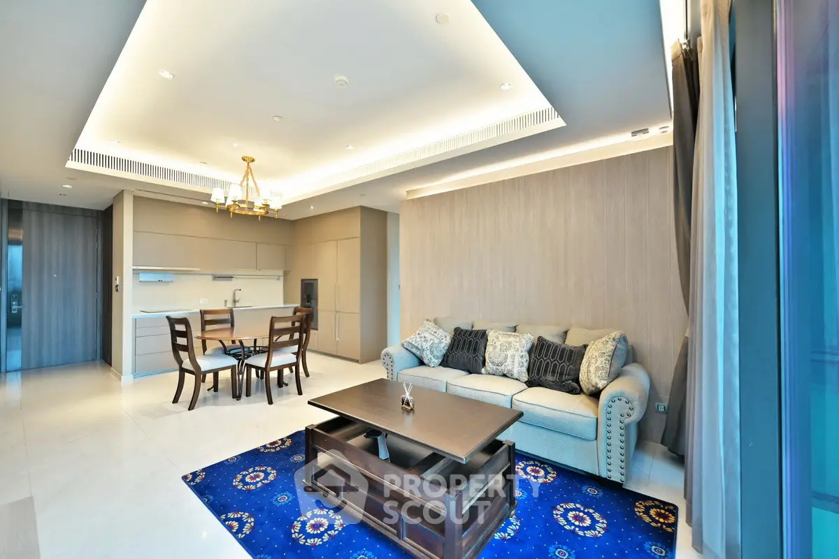 Luxurious modern living room with elegant furniture and open kitchen layout