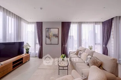 Luxurious modern living room with panoramic city views and elegant decor