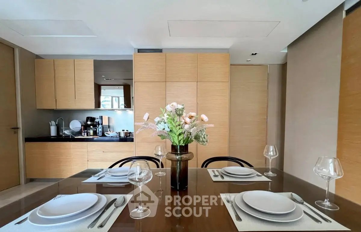 Elegant dining area with modern kitchen and stylish decor