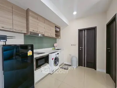 Modern kitchen with sleek appliances and stylish cabinetry