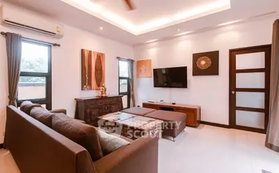 Spacious living room with modern decor and natural light