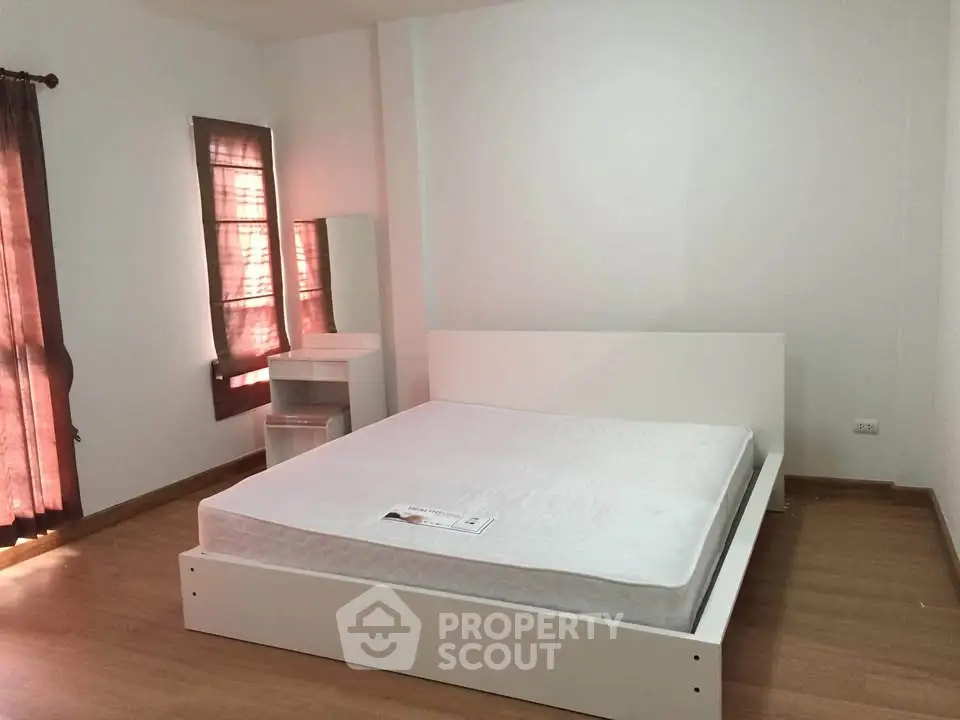 Spacious bedroom with minimalist design and natural light