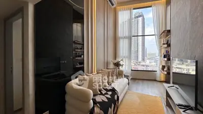 Luxurious modern living room with stunning city view and elegant decor