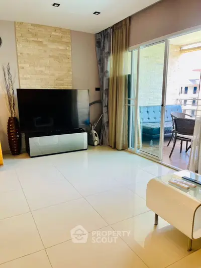 Modern living room with sleek design and large windows offering ample natural light.