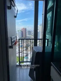 Compact balcony with city view, perfect for urban living.