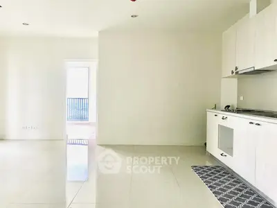 Spacious modern kitchen with sleek cabinetry and open layout, perfect for contemporary living.