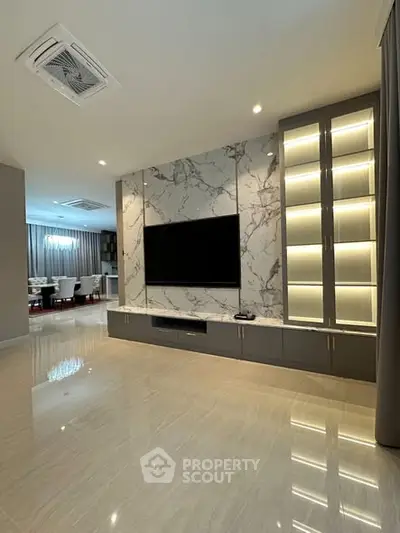 Luxurious living room with marble feature wall and built-in TV unit