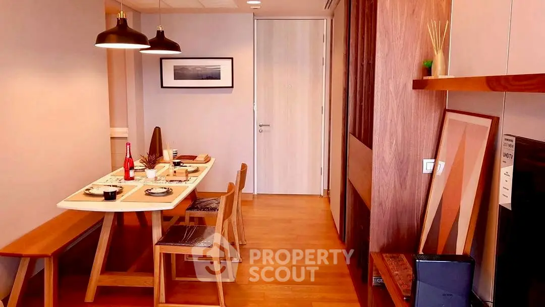 Modern dining area with wooden furniture and stylish decor in a cozy apartment.