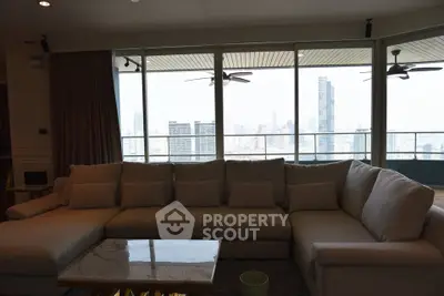 Spacious living room with panoramic city view and modern sofa set