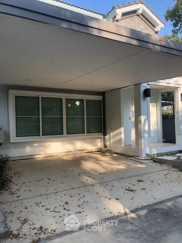 Charming suburban home with spacious driveway and modern exterior design.