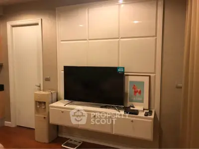 Modern living room with wall-mounted TV and stylish decor
