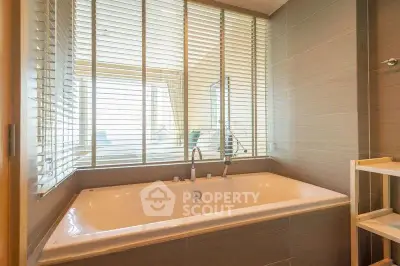 Luxurious bathroom with large bathtub and modern design