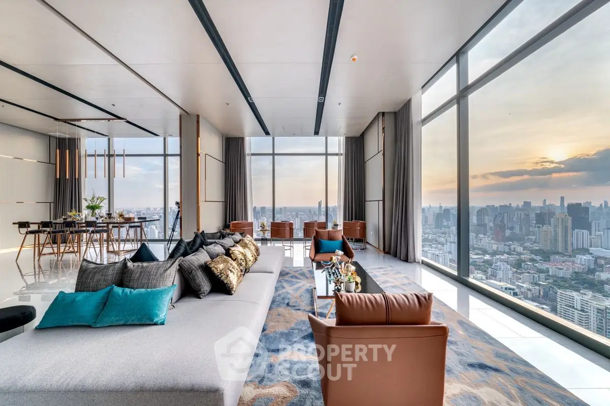 Luxurious high-rise living room with panoramic city views and modern decor.