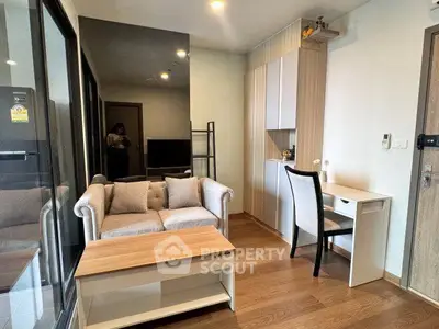 Modern living room with cozy sofa and stylish decor in a contemporary apartment.