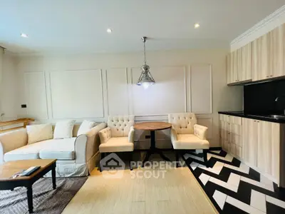 Chic modern living room with stylish furniture and open kitchen layout
