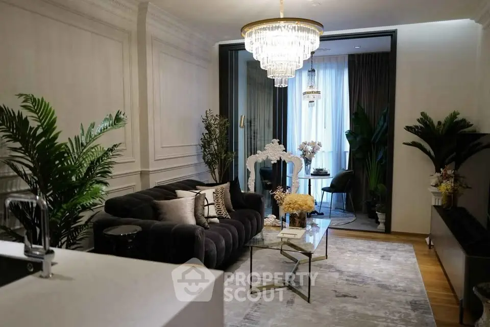 Luxurious living room with elegant decor and chandelier lighting