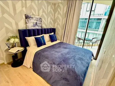 Modern bedroom with stylish decor and balcony view in luxury apartment