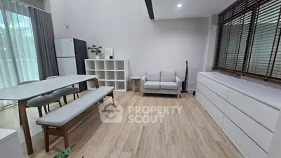 Spacious modern living room with dining area and minimalist decor