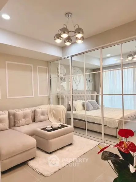 Elegant living room with mirrored closet and cozy sectional sofa