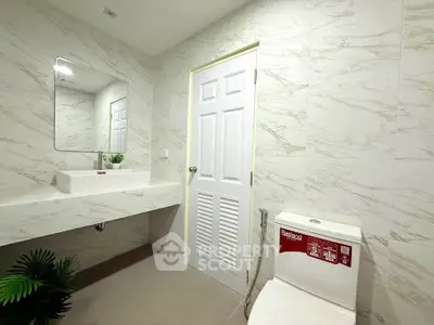 Modern bathroom with sleek marble tiles and contemporary fixtures