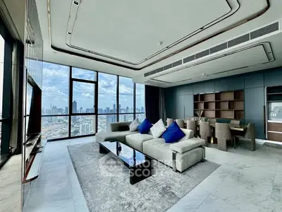 Luxurious modern living room with stunning city view and elegant decor.