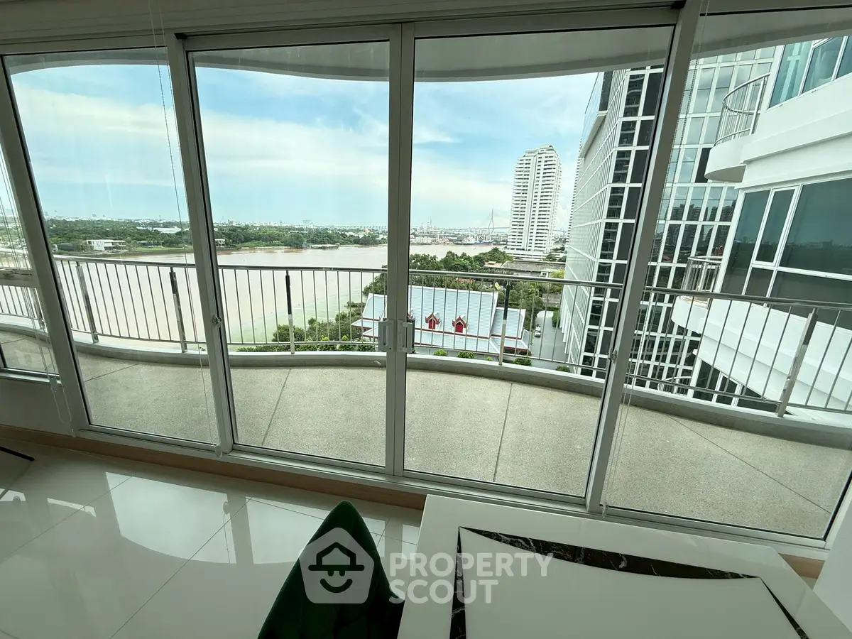 Stunning high-rise condo with panoramic river view and spacious balcony.