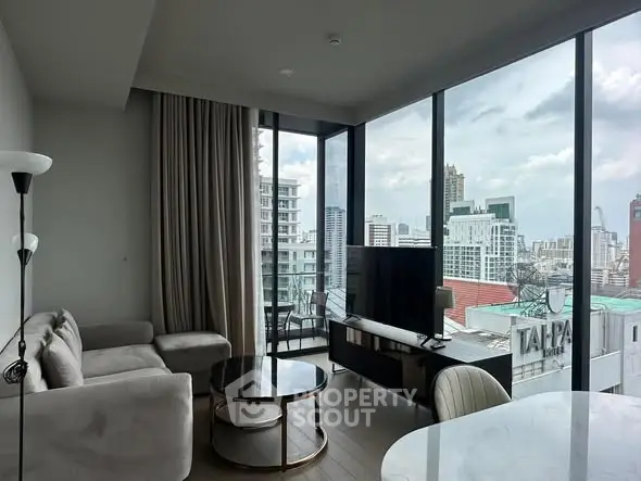 Modern living room with panoramic city view and stylish furniture