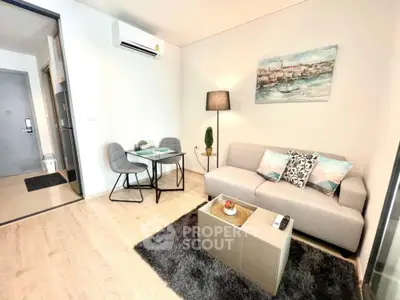 Chic modern living room with plush sofa, elegant decor, and a cozy dining area, perfect for urban living and entertaining guests.